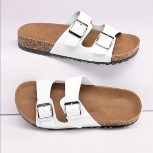 Two strap white buckled sandals